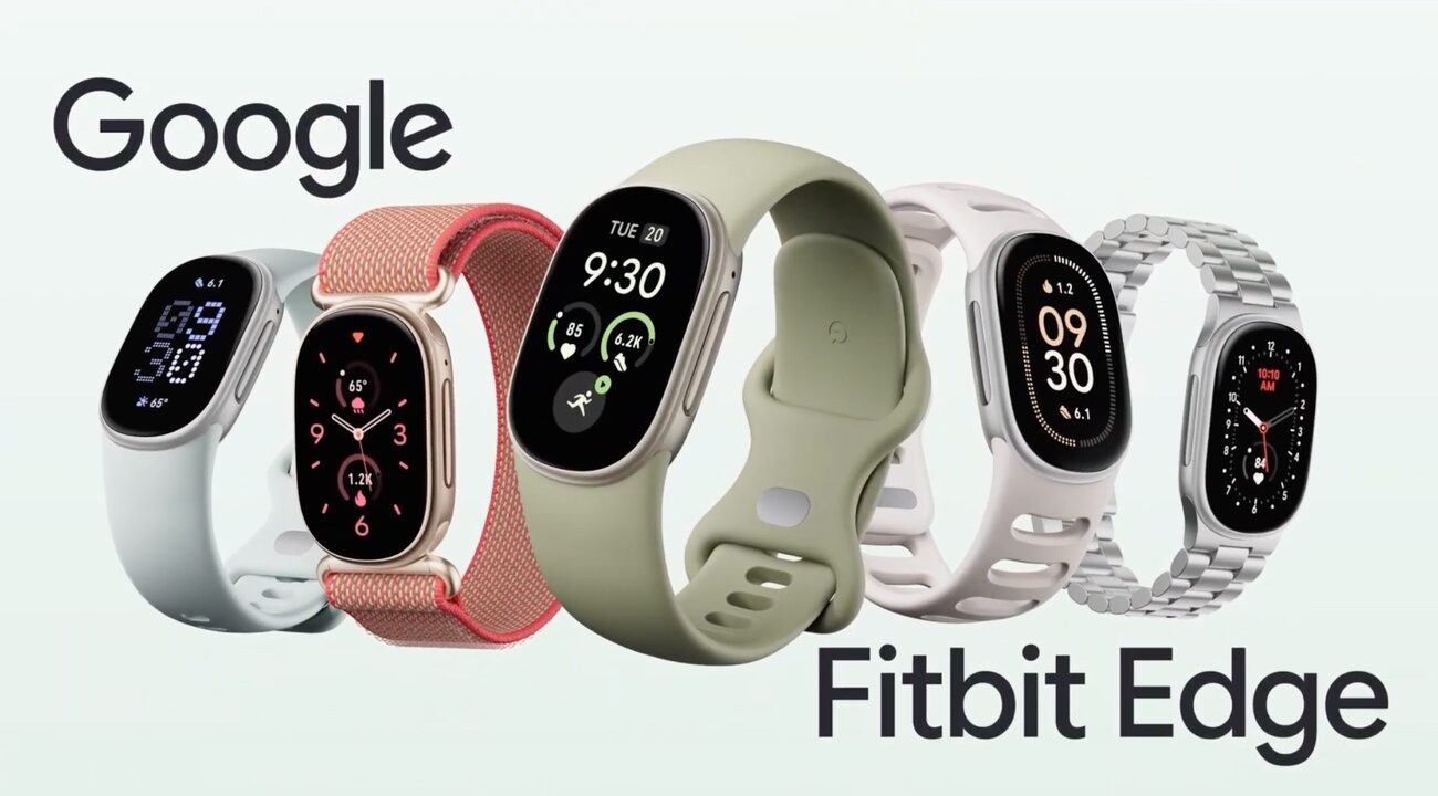 Cinco pulseras Fitbit Edge de distintos colores y correas, con la pantalla alargada encendida